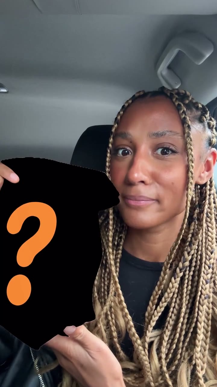 Vertical creator video for Burger King: a woman in a parked car hides the bag behind a black question-mark card, reveals it and takes a bite of a crispy chicken burger, with orange Burger King-style type popping in around her.